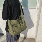 Sac messager en toile de couleur unie