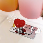 Bouton de coeur pour les toilettes